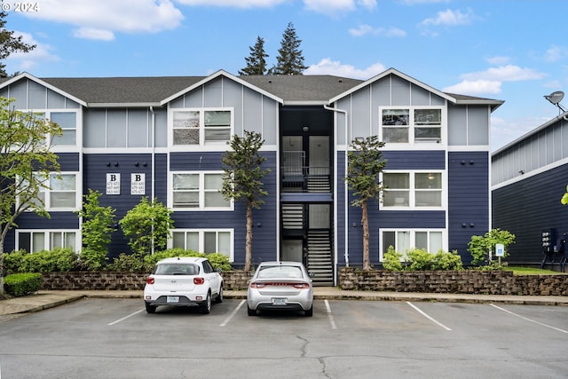 view of property featuring uncovered parking