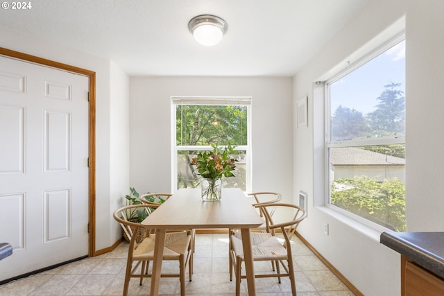 dining room with baseboards