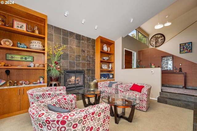 carpeted living room featuring built in shelves, a fireplace, and tile walls