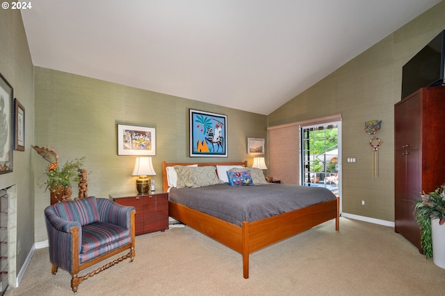 carpeted bedroom with access to outside and lofted ceiling