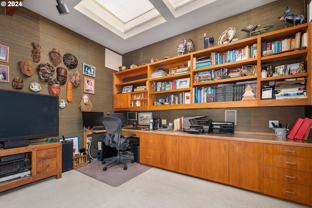 office space featuring built in desk and light colored carpet