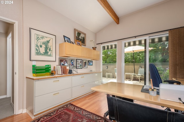 office featuring lofted ceiling with beams and light hardwood / wood-style flooring