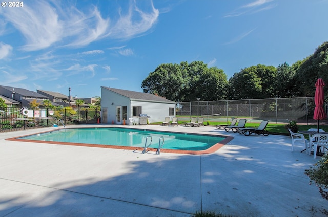 view of swimming pool featuring a patio