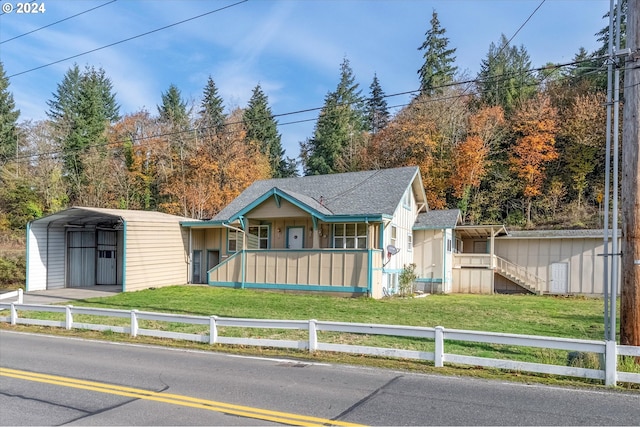 view of front facade featuring a carport and a front lawn