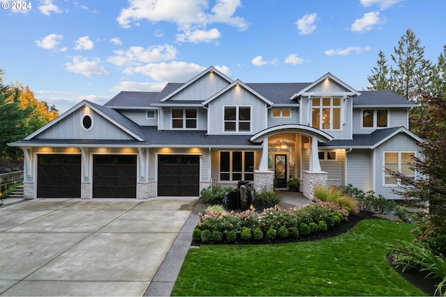 view of front facade featuring a garage and a front lawn