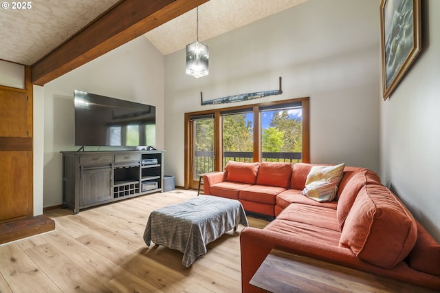 living room featuring beamed ceiling, light wood finished floors, and high vaulted ceiling