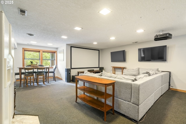 home theater with carpet flooring, baseboards, visible vents, and a textured ceiling