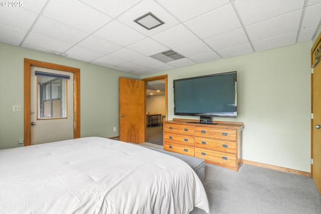 bedroom featuring visible vents, carpet, baseboards, and a paneled ceiling