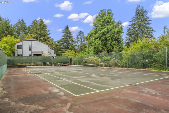 view of sport court with fence