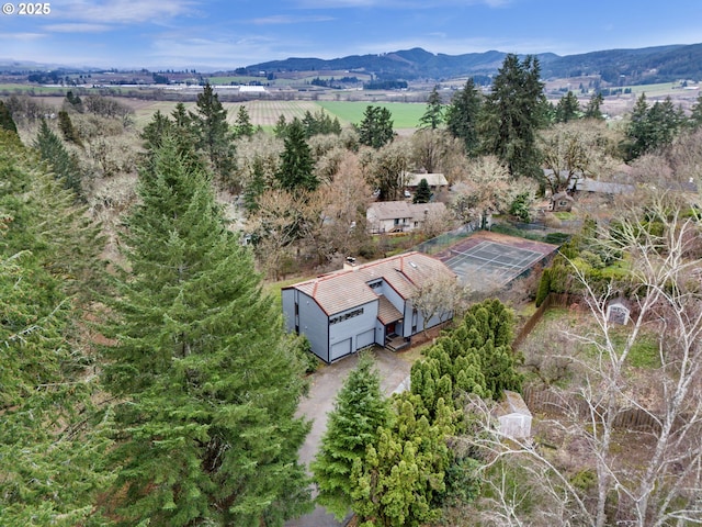 drone / aerial view with a mountain view and a rural view