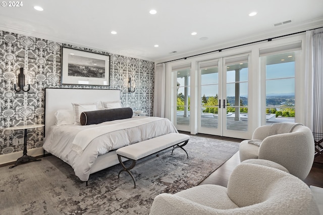 bedroom featuring french doors, ornamental molding, access to exterior, and wood-type flooring