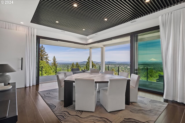 dining space featuring wood-type flooring and a mountain view