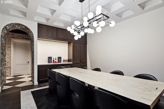 dining space featuring coffered ceiling, beam ceiling, and ornamental molding