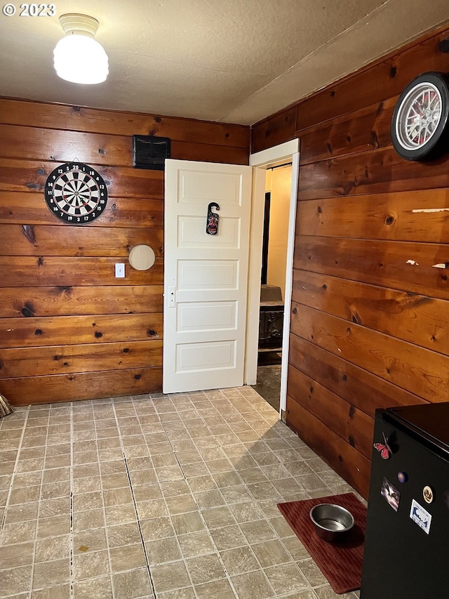 interior space featuring wood walls