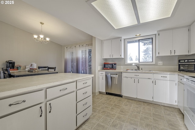 kitchen with sink, decorative light fixtures, white cabinetry, and stainless steel dishwasher