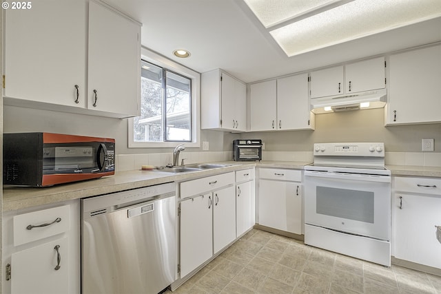 kitchen with white range with electric cooktop, stainless steel dishwasher, and white cabinets