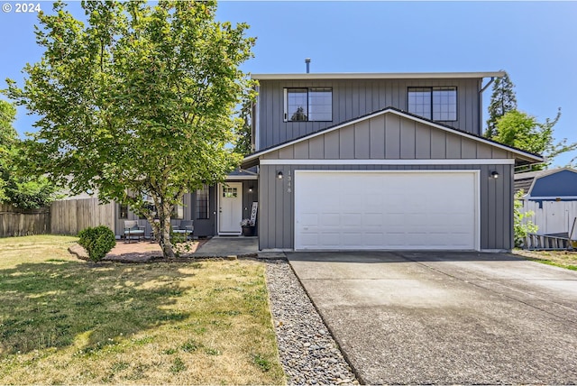 view of front facade featuring a garage and a front lawn