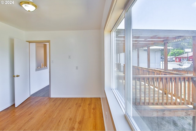 empty room with wood finished floors and baseboards