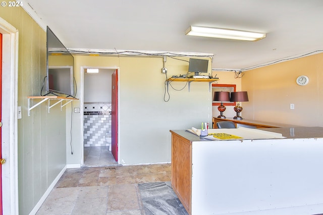 kitchen featuring stone finish floor