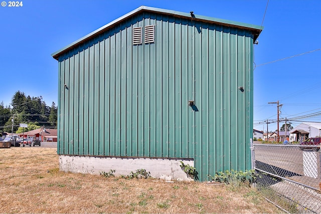 view of outbuilding with a yard