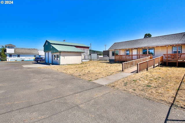 view of front of property featuring a wooden deck