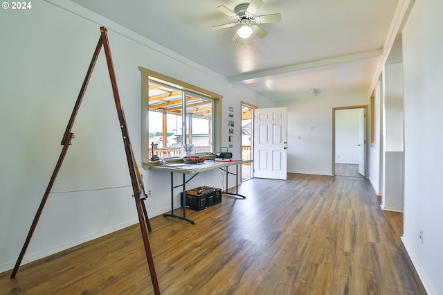 foyer entrance featuring a ceiling fan, beam ceiling, wood finished floors, and baseboards