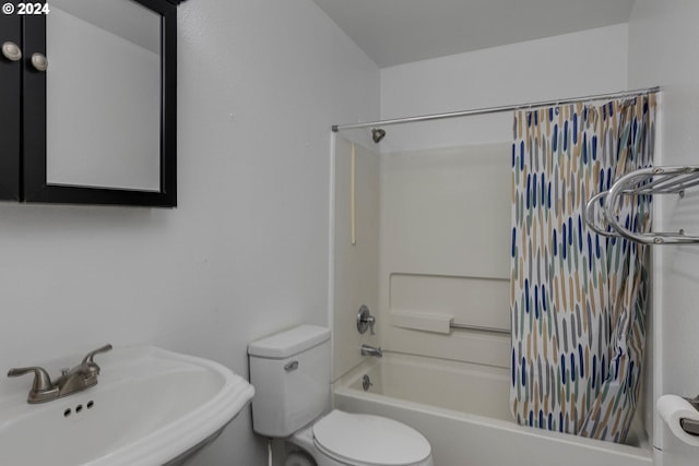 full bathroom featuring toilet, sink, and shower / tub combo