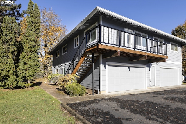 view of side of property with a garage