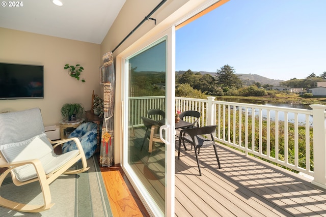 balcony with a water and mountain view