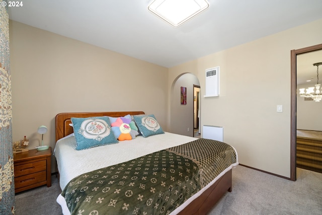 bedroom featuring light colored carpet