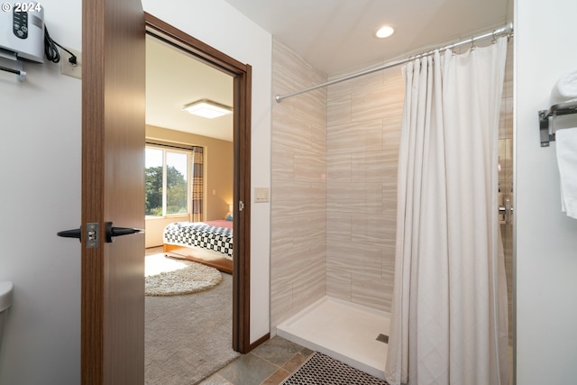 bathroom featuring tile patterned flooring and a shower with curtain