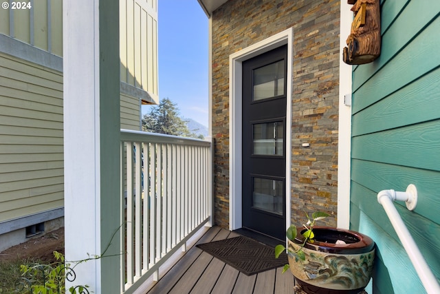 entrance to property with a balcony