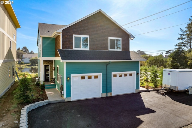 view of front of property with a garage