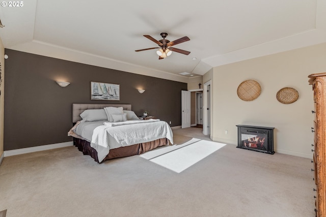 carpeted bedroom featuring ceiling fan and vaulted ceiling