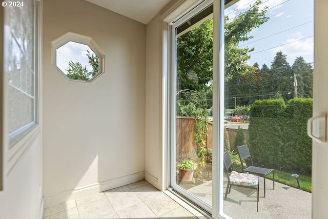 doorway featuring light tile patterned floors