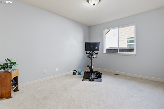 workout area with light colored carpet