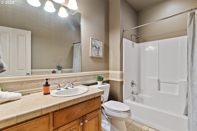 full bathroom with toilet, tasteful backsplash, shower / bath combination with curtain, tile patterned floors, and vanity