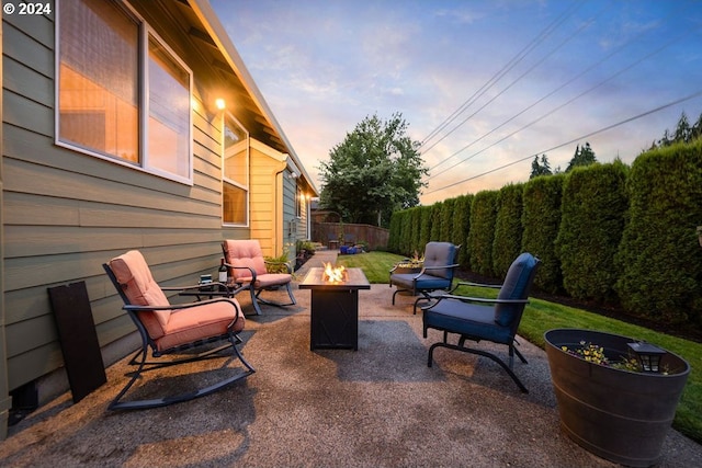 patio terrace at dusk with a fire pit