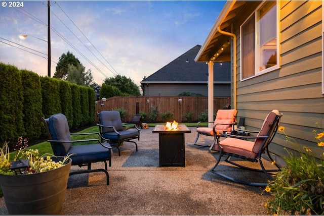 view of patio / terrace featuring an outdoor fire pit