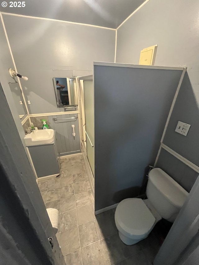 1074 Fir Ave, Reedsport, OR 97467 - bathroom featuring a shower with shower door and vanity