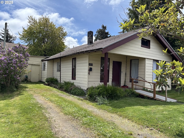 1074 Fir Ave, Reedsport, OR 97467 - bungalow-style house featuring a front yard and a porch