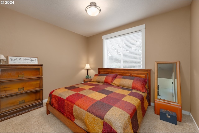 bedroom with light colored carpet