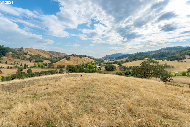 view of mountain feature with a rural view