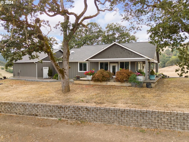 ranch-style house featuring covered porch