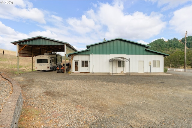 view of outbuilding featuring a carport