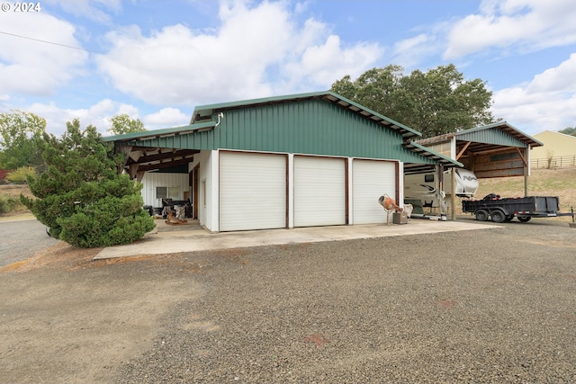 garage featuring a carport