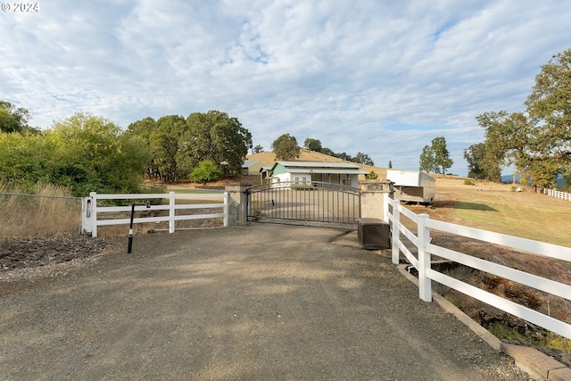 view of gate featuring a rural view