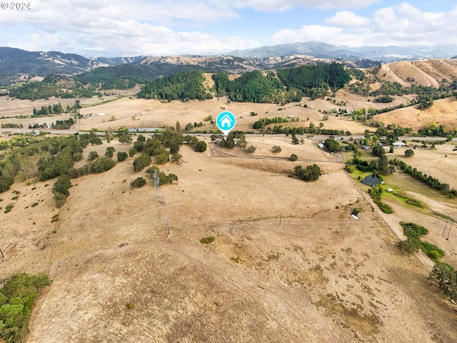 bird's eye view featuring a mountain view and a rural view