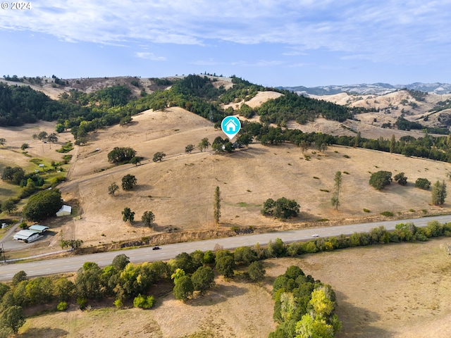 aerial view featuring a mountain view and a rural view