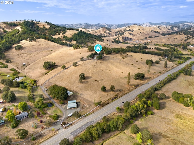 bird's eye view with a mountain view